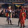 the hunter Gonpo Dorje, and the atsara, dance of Milarepa (Sha ba sha khyi 'cham), Paro Tshechu (tshes bcu), dance arena, Paro Tshechu (tshes bcu), 2nd day