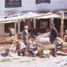 workers in front of msad tsha apartment compound