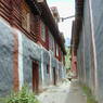 Alley between houses leading to Derge Monastery's Assembly Hall.