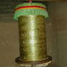 Large metal prayer wheel in the Assembly Hall.