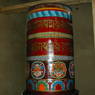 Large painted prayer wheel in the Assembly Hall.