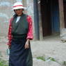 Tibetan woman next to the monastery.