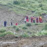 Tibetan monks and laypeople relaxing on the road.