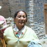 A Tibetan woman with prayer wheel.