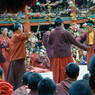 Monks performing in the inner courtyard of the Assembly Hall ['du khang] for the morning teachings.