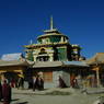 Monks and lay circumabulating the Gyutrul Temple [sgyu 'phrul lha khang].