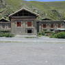 A Tibetan house along the side of the road.