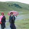 Tibetan women walking on the road.