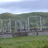 A power station with yak dung drying on the outer wall.