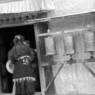 A nomad woman entering a chapel.