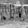 Pilgrims prostrating to the wall of carvings.