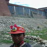 A young Tibetan girl standing in front of the South Complex.