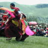 Monks dancing with silk streamers.