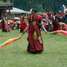 Monks dancing with silk streamers.