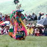 A black hat dancer performing in the courtyard.