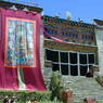 A large thangka painting of Padmasambhava hung on the outer wall of the Assembly Hall.