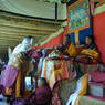 One of the masked dancers offering a silk scarf to Abbot Dorji Tashi.