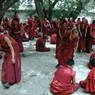 Monks debating religious topics in the debate courtyard.