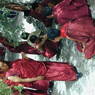 Monks debating religious topics in the debate courtyard.