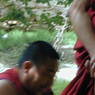 A monk debating religious topics in the debate courtyard.