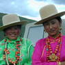 Tibetan women wearing large necklaces.