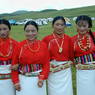 Four dancers wearing red shirts.