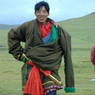 A young Tibetan nomad man wearing a sword.