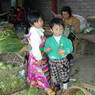 Two young Tibetan children at the vegetable market.