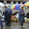 A Tibetan man wearing a fancy chuba at the vegetable market in Serta Town.