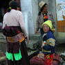 Tibetan buying meat at the roadside butcher's.