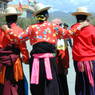 Three Tibetan nomad women walking down the street in Serta Town.