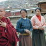 A Chinese nun and two Tibetan women waiting for Khenpo Jikme Phutsok, the founder of the Larung Gar religious community, to arrive.