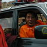 Khenpo Jikme Phutsok [mkhan po 'jigs med phun tshogs], the founder of the Larung Gar [bla rung gar] religious community, arriving in his car.