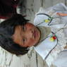 A young Tibetan girl in one of the monastery's courtyards.