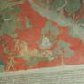 A close up of a scene depicting various figures on the walls of the inner circumambulation corridor.
