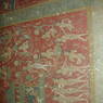 A close up of the right side of a scene depicting various figures on the walls of the inner circumambulation corridor.