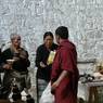 Pilgrims make offerings and request prayers