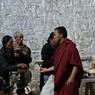 Pilgrims make offerings and request prayers