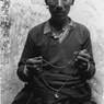 Villager holding his prayer beads.