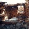 The interior of a ruined building in the middle complex. Note the very long in situ bridging stone.