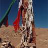 The prayer flag-draped pillar.