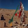 The prayer flag-draped pillar.