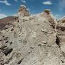 The highly eroded earthen walls of the castle.