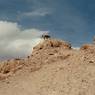 Cobble wall traces and earthen structures thought to belong to the ancient castle on the formation summit.