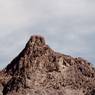 The rock formation, with castle ruins on the summit.