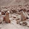 Upright stones probably marking the entrance to a structure on the lower bench.