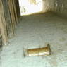 Prayer wheel inlaid into wall of tunnel between houses in 'Khor chags village