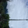 A prayer flag pole near a house in the village of bdud ma, in Kong po