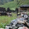 Houses ruined by fire in the village of Lo, in Kong po