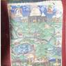 A thangka painting in {rad nis} Temple showing Mt. Kailash, the surrounding regions, and monasteries.